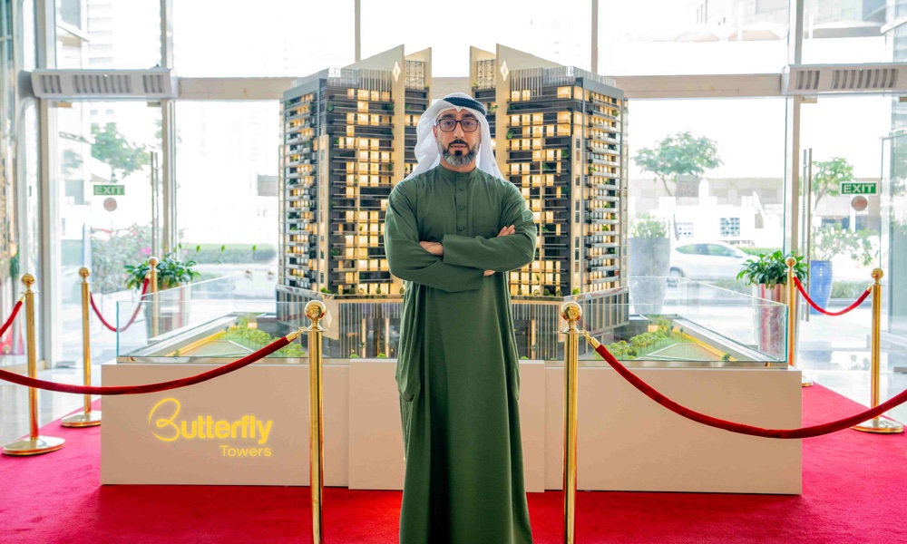 Marwan-Al-Sayyah-CEO-of-Al-Sayyah-Group-showcasing-a-model-of-the-Butterfly-Towers-1.jpg