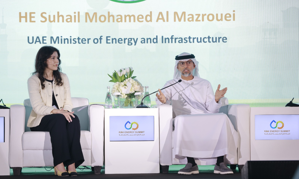 Session-Chair-Razan-Al-Ghussein-welcomes-HE-Suhail-Mohamed-Al-Mazrouei-UAE-Minister-of-Energy-and-Infrastructure1-1.jpg